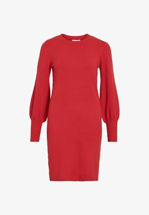 Červené pletené šaty s dlhými, vyp puffovanými rukávmi a okrúhlym výstrihom. Má rebrované manžety a rovný, po kolená siahajúci strih. Mäkkučká textúra.