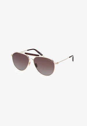 Goldene Metall-Aviator-Sonnenbrille mit dunklen Verlaufslinsen. Verfügt über einen dünnen Rahmen und braun akzentuierte Bügel. Logo auf einem Bügel angebracht.