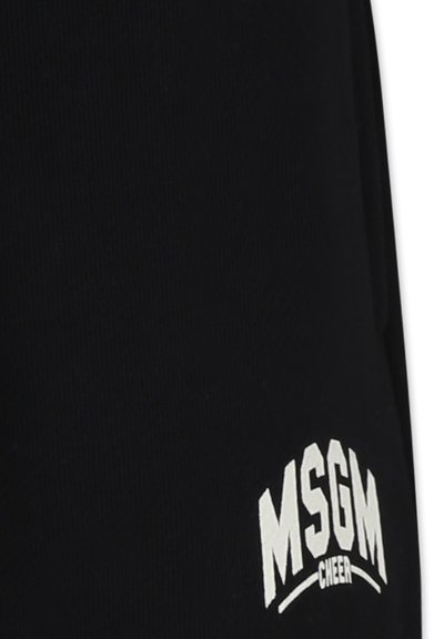 Pantaloni felpati neri in cotone con texture a coste, caratterizzati da scritte bianche "MSGM CHEER" e un design dal taglio rilassato.