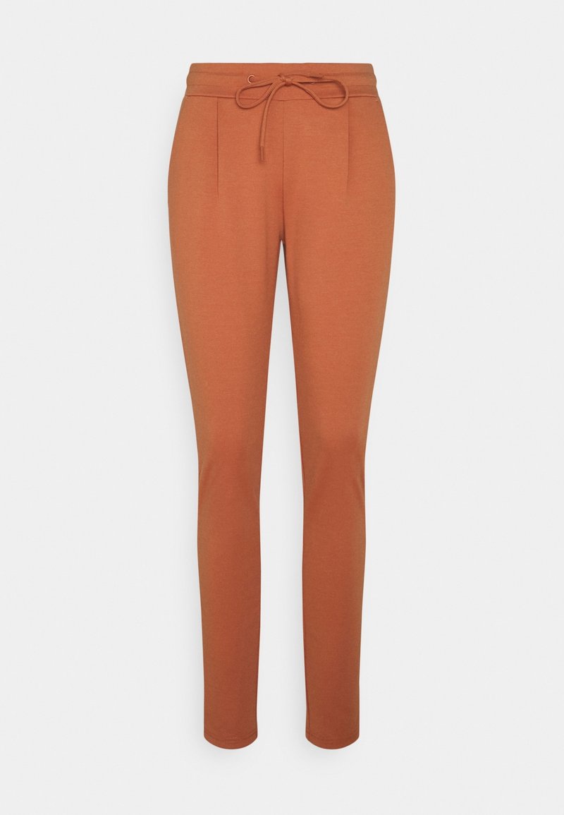Pantalones de terracota con cintura ajustable, perneras acampanadas y dos pliegues delanteros. Tejido suave con una textura lisa.