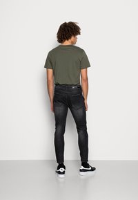Alessandro Zavetti BONDINI SLIM - Calças de ganga justas - black
