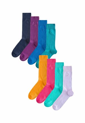 Set aus acht Socken in verschiedenen Farben: dunkelblau, lila, türkis, kräftiges Orange, pink, helltürkis und lavendel. Glatte Textur und mittlere Schafthöhe.