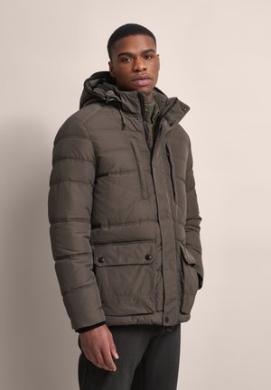 Olive green puffer jacket with a hood, featuring stitched panels, zippered and snap pockets, and a textured fabric.