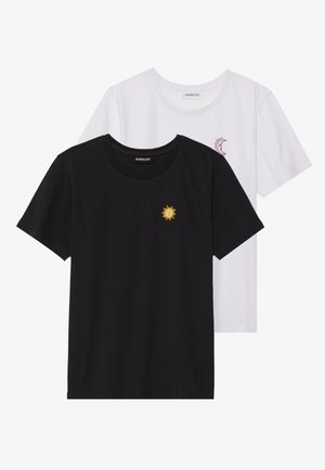Black and white T-shirts, round neck, short sleeves. Black shirt features yellow sun embroidery; white has purple crescent moon accent.