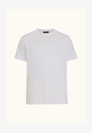 Schlichtes weißes T-Shirt mit kurzen Ärmeln und Rundhalsausschnitt, mit einem kleinen schwarzen Nackenetikett, vor einem hellbeigen Hintergrund dargestellt.