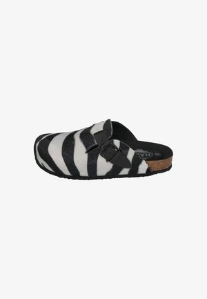Zebra-patterned clogs with a black buckle. Made of soft material, featuring a cork sole and a round toe design. Black and white color scheme.