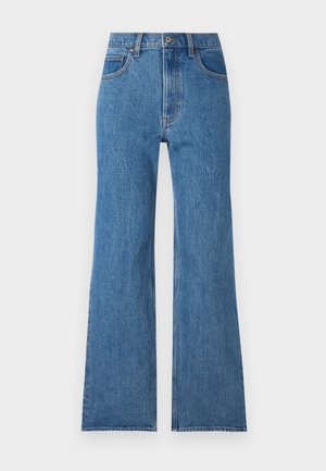 Blauwe denim jeanen met een hoge taille en wijd uitlopende pijpen, voorzien van een ritssluiting en vijf zakken. De stof heeft een klassieke textuur met vervaagde details.