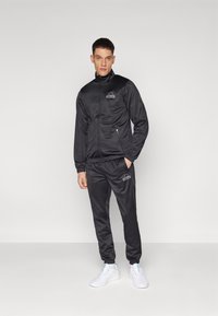 Ellesse - KARTONI JACKET AND PANT SET - Trenirka - black Miniaturna slika 1