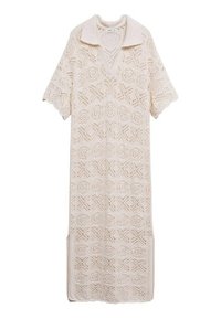 Robe en tricot beige clair avec un col, des manches courtes et un motif géométrique ajouré. Les fentes latérales améliorent le mouvement.