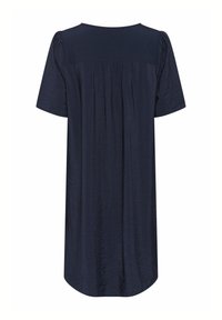 Laivansinis lyhythihainen mekko suipolla selkäpuolella, pehmeästä materiaalista, pyöreällä kaula-aukolla ja väljällä leikkauksella, joka ulottuu polven ylle.
