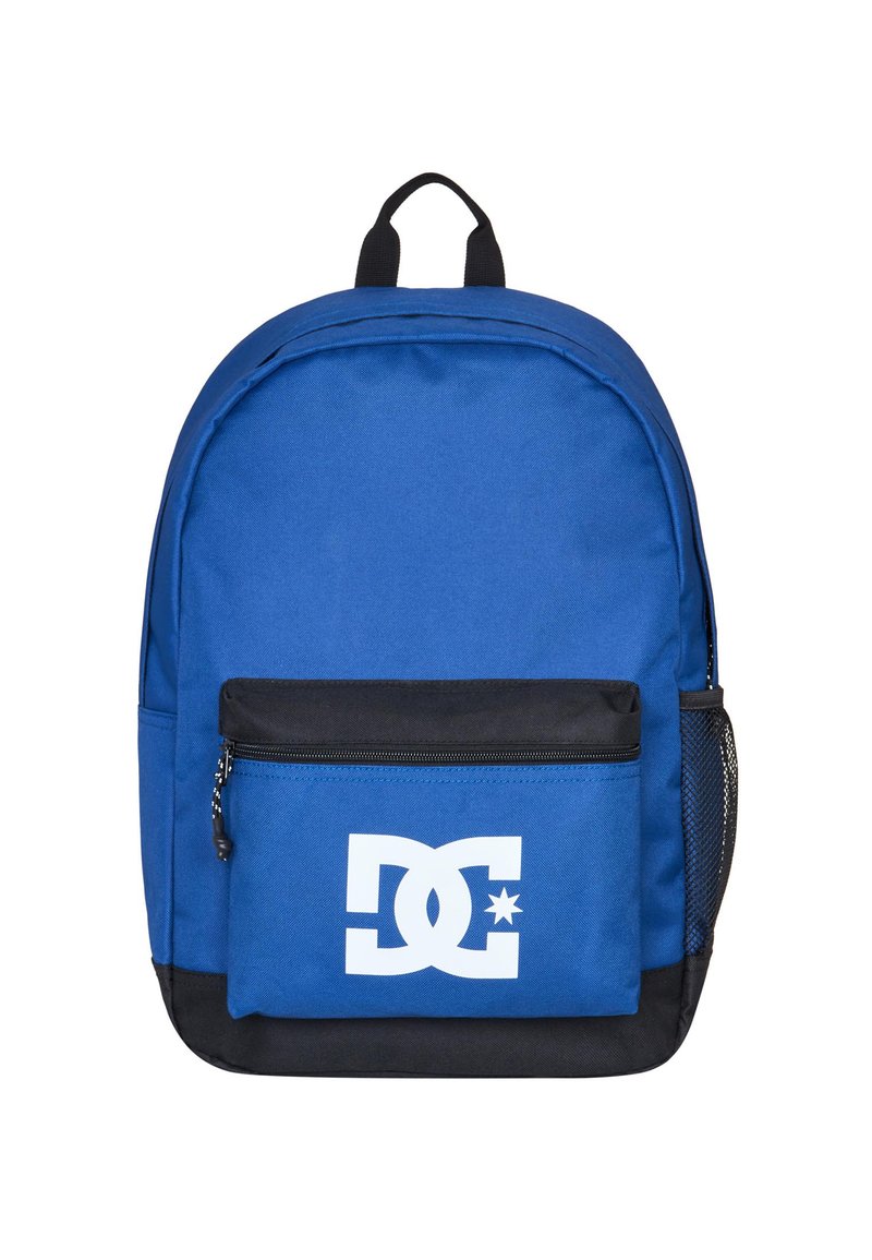 Blue fabric backpack with black bottom, front zip pocket, and a large white DC logo. Features a top handle and side mesh pocket.