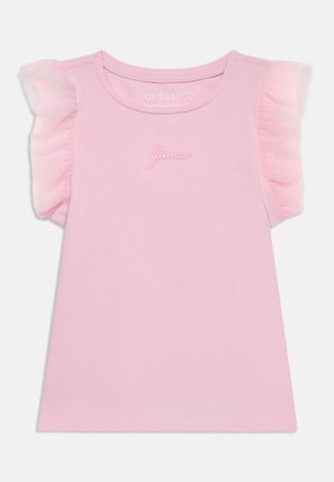 Różowy bezrękawnik dziecięcy z falbanowymi tiulowymi rękawami i haftowanym logo "Guess" na piersi.