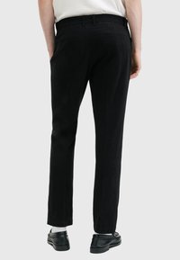 AllSaints HERON  - Puvunhousut - black