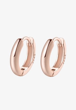 Pendientes de aro en oro rosa con un acabado suave y pulido. El diseño es compacto, con una forma redondeada y sin costuras. Detalles visibles de tamaño y material.