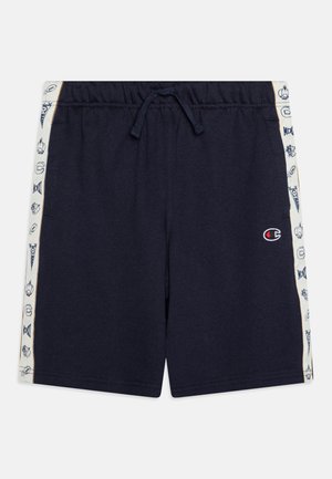 Shorts navy avec une taille à cordon de serrage, dotés de panneaux latéraux avec des graphismes blancs. Confectionnés en coton doux, présentant un design simple et fonctionnel.