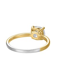 Gold and silver two-tone ring featuring a round clear gemstone, with a smooth band and prong setting, highlighting contrasting metal colors.