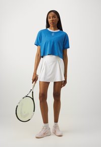 Nike Performance HERITAGE CROP TEE - Spordi T-särk - star blue
