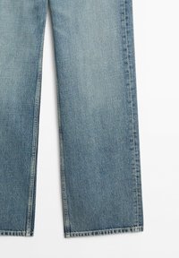 Light blue denim jeans with straight legs, visible seams, and a slightly faded texture on a white background.