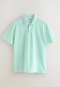 Világos zöld polo ing geometrikus mintával, klasszikus gallérral és rövid ujjakkal, semleges hátteret kínálva.