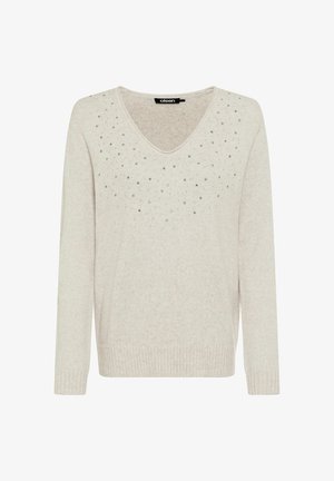 Maglione color beige chiaro con maniche lunghe, scollo a V e decorato con borchie argento sparse sul pannello frontale. Orlo e polsini a coste.