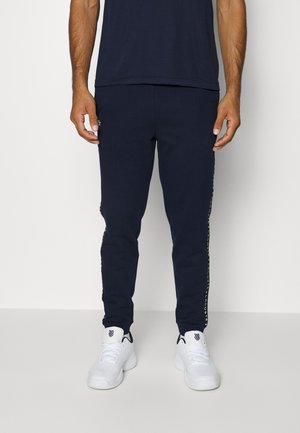 PANT TAPERED - Tracksuit bottoms - bleu marine