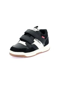 Baskets noir et blanc avec des bandes Velcro, matériaux en cuir et en daim, bout rond, semelle blanche contrastante avec une semelle en caoutchouc gomme.