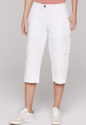 White cargo shorts made of lightweight fabric, featuring side pockets, a button closure, and a cropped hem that extends to mid-calf.