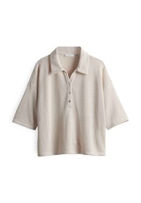 Beige kortärmad polo skjorta med textilstruktur, tre-knapps stängning och krage. Har en lös, boxig passform.