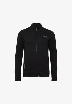 Schwarze Zip-Jacke aus weichem Material, mit einem hohen Kragen, zwei Fronttaschen und einem Logopatch im linken Brustbereich.