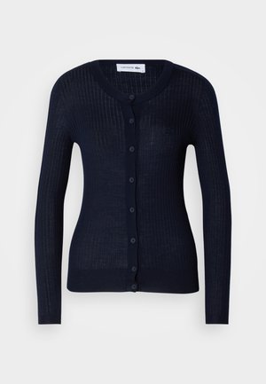 Navy ribbed cardigan made of lightweight material, featuring a round neck, long sleeves, and a full button placket with six buttons.