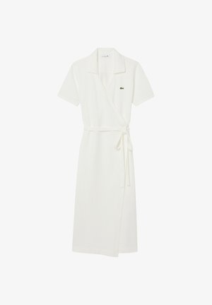 Vestito corto bianco a maniche corte con collo a camicia, cintura a fiocco laterale e piccolo logo di coccodrillo verde sul petto.