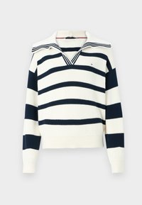 Kerman ja navy blue raitapaitaa, jossa on leveä kaulus ja V-halkio, pitkät hihat sekä ribattu helma ja hihansuut.