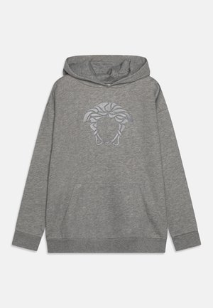 Gray hoodie made of soft fabric, featuring a front pocket and a graphic of a face with wavy hair. Hooded design with ribbed cuffs.