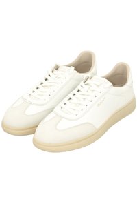 White leather sneakers with a smooth finish, round toe, and tonal laces. Features a beige rubber sole and subtle branding on the side.
