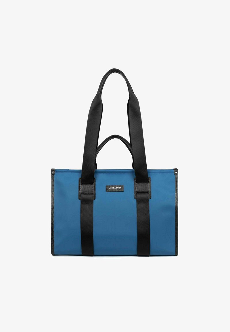 Borsa a tracolla blu realizzata in materiale resistente con manici e dettagli neri. Presenta una placca con logo e una forma rettangolare con chiusura a zip.