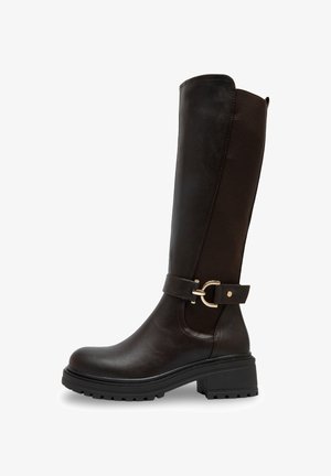Bottes marron jusqu'aux genoux avec une finition en cuir lisse et un panneau en tissu. Dotées d'une sangle avec boucle et d'une semelle en caoutchouc épaisse pour une meilleure adhérence.