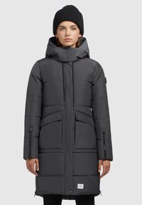 Padded dark gray parka with a zip closure, adjustable hood, and two front pockets. Features textured fabric and a branded label at the hem.