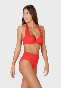 Red bikini set featuring a padded halter top with draped fabric and high-waisted bottoms for a flattering shape. Smooth, stretchy material.