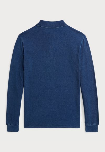 Navy blue long-sleeve polo shirt with a collar, featuring a subtle textured pattern and ribbed cuffs. Clean, minimal design with a classic fit.