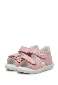 Rosa Leder-Sandalen mit zwei Klettverschluss-Riemen, offener Zehenpartie und einem weichen weißen Innenfutter. Mit einer Gummisohle mit minimalem Profil.
