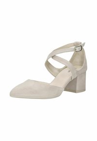 Beige suede ankle strap pump with a pointed toe, cross-strap design, and a block heel. Smooth texture and minimalistic style.