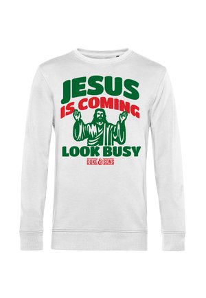 Witte sweatshirt met opvallende groene en rode tekst. Het ontwerp bevat een afbeelding van Jezus met uitgestrekte armen en de tekst "JESUS KOMT, KIJK DRUK."