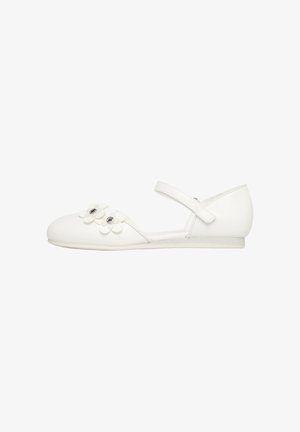 White flat Mary Jane shoe with ankle strap and two decorative white flowers with rhinestone centers on the toe.