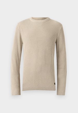 Suéter beige con canalé, cuello redondo, mangas largas y tela texturizada. Presenta una pequeña etiqueta en el dobladillo.