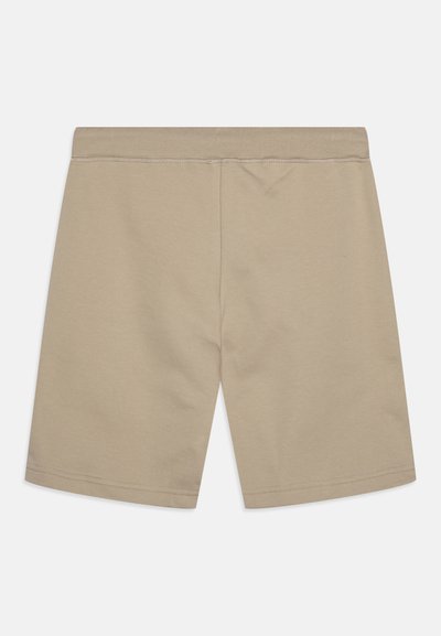 Shorts en coton beige avec une texture lisse, dotés d'une taille élastique et d'une coupe droite, sans poches ni embellissements visibles.