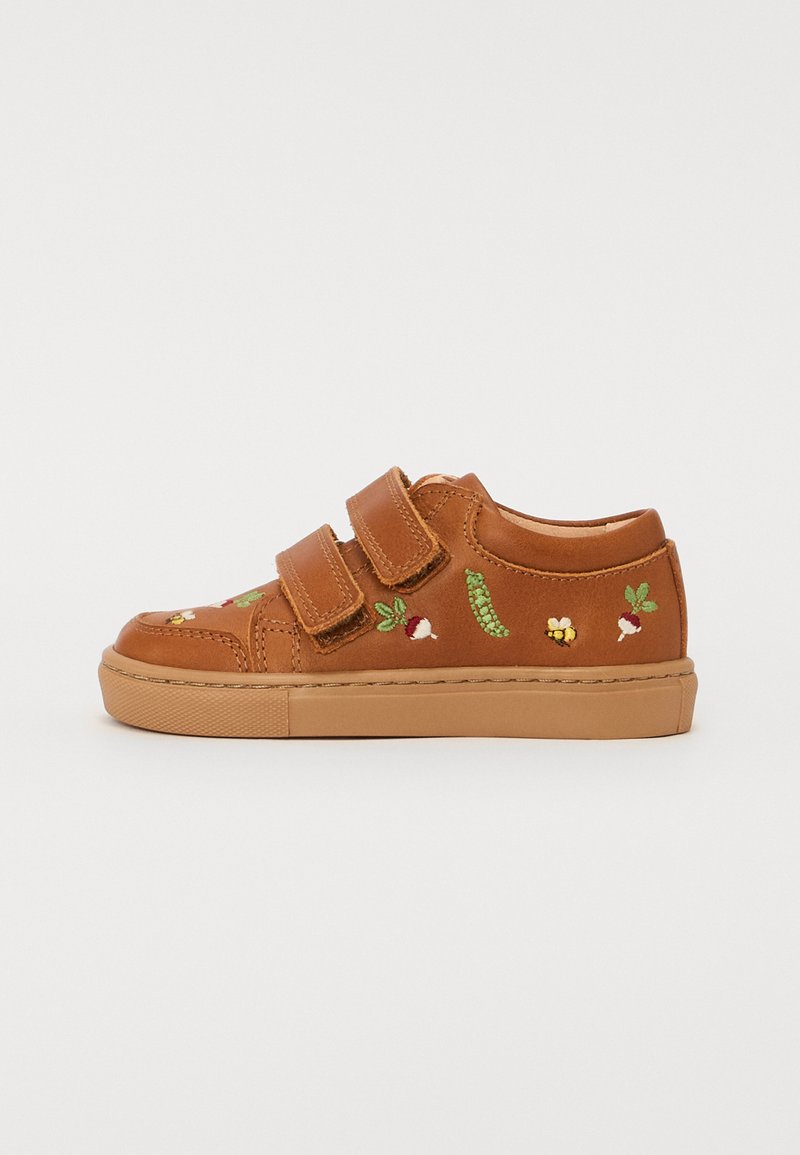 Brown leather sneakers with two Velcro straps, featuring colorful embroidered designs of vegetables and bees on the sides. Rubber sole.