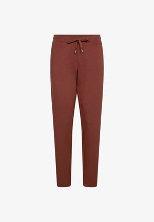 Pantaloni jogger color ruggine realizzati in morbido tessuto, con cintura elastica e cordino, e gamba svasata.