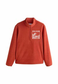 Fényes narancssárga polár pulóver, magas gallérral és fél cipzárral az elején. Fehér grafikával díszített a mellrészen. Simább tapintású anyag.