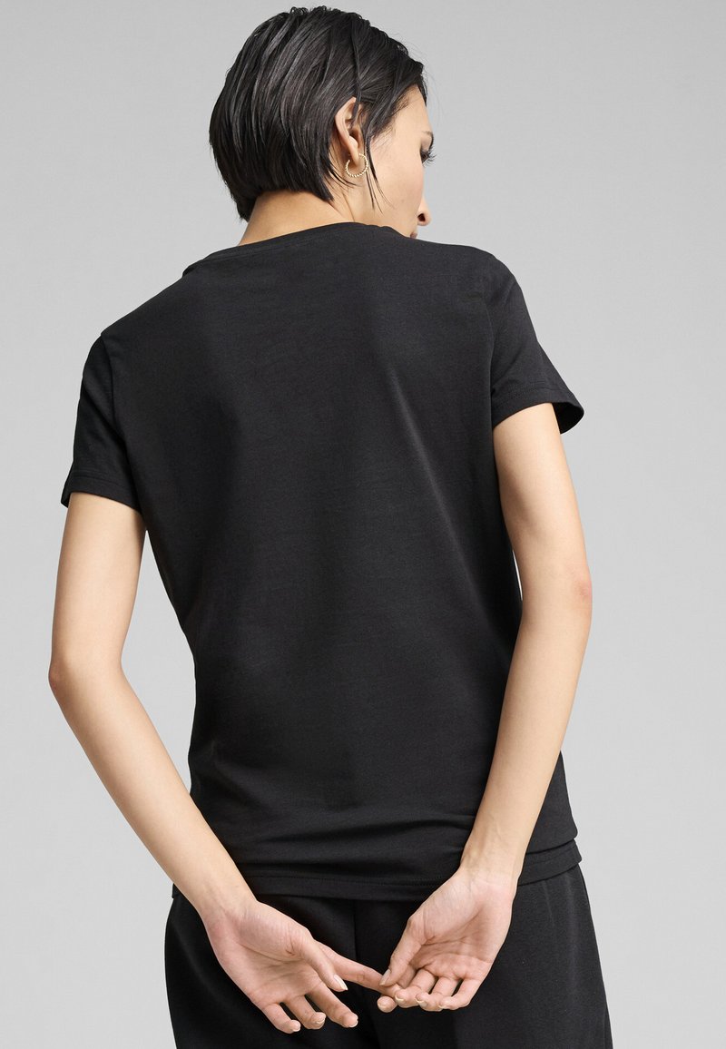 Puma LOGO TEE - Triko s potiskem - black/metallic gold-coloured