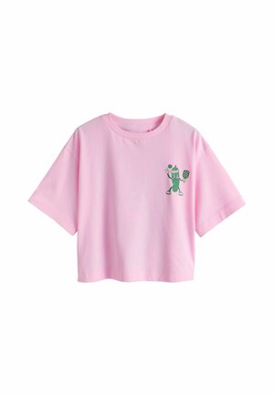 Pink cropped short-sleeve T-shirt with a small green pickle character playing pickleball printed on the left chest.